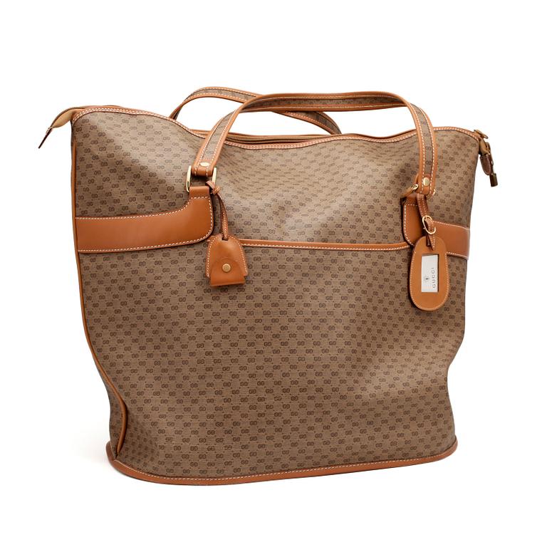 GUCCI, a monogram canvas weekendbag.