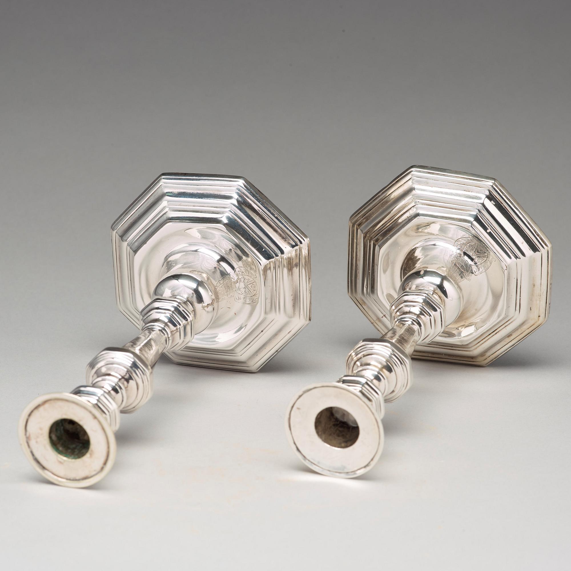 A pair of European 18th century silver candlesticks, unidentified makers mark.