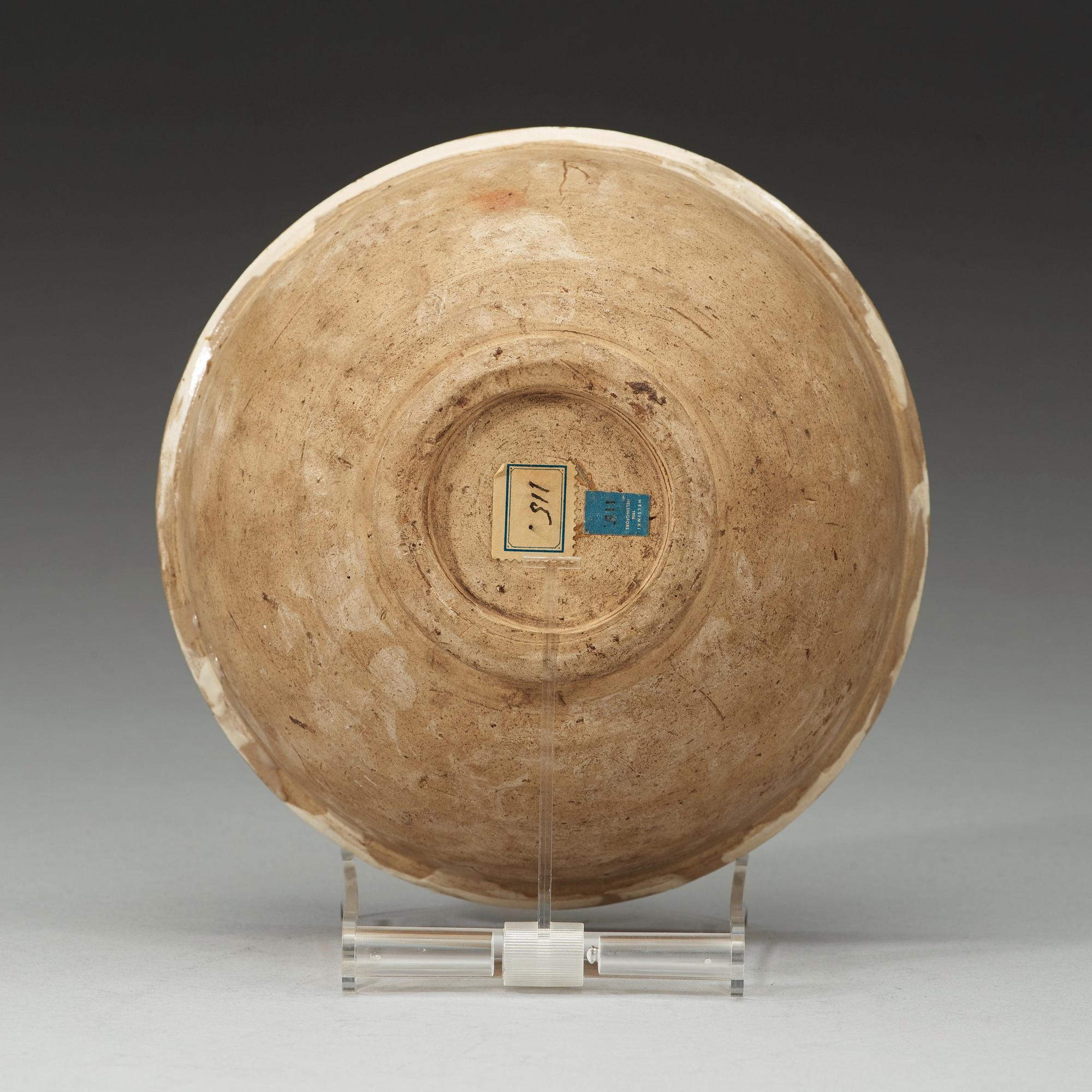 A marbled on white slip-glazed earthenware bowl, Song dynasty (960-1279).