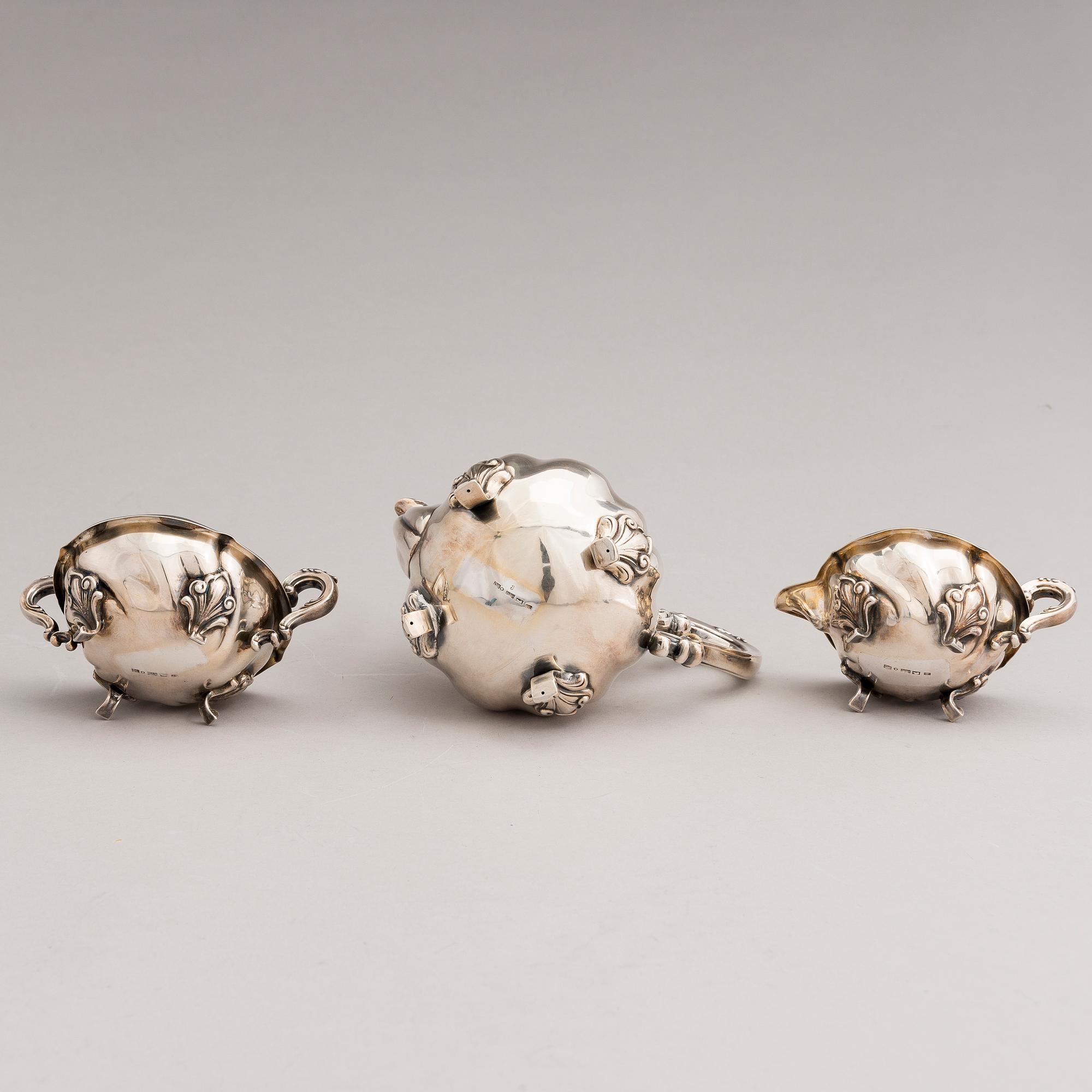 A silver sugar tong and a 3-piece silver coffee set, mark of Juho H. Pekuri, Oulu 1931 and Finnish import marks 1938.