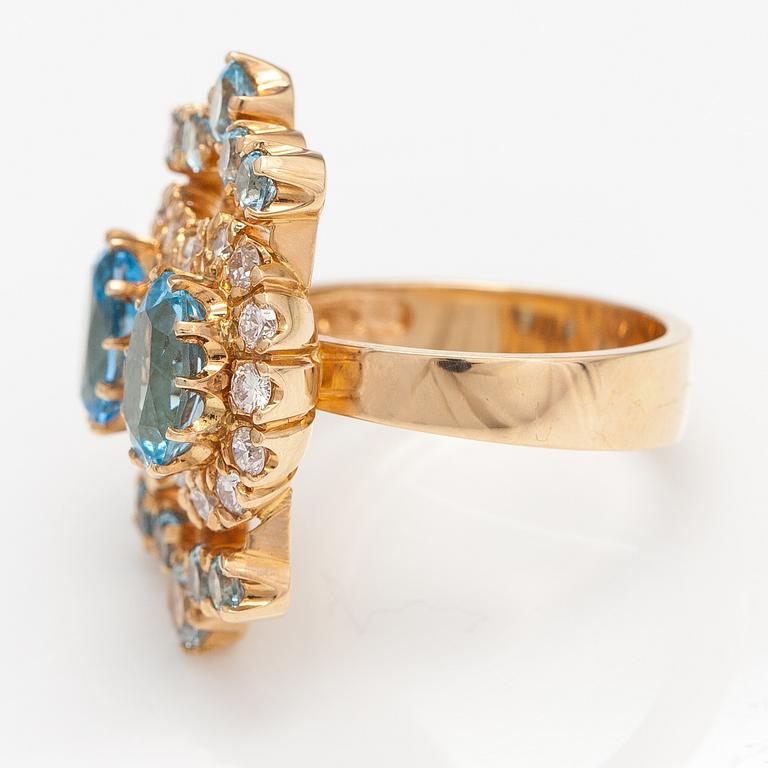 An 18K gold ring "Sophia Albertina" with diamonda ca. 0.54 ct in total and topazes. Ofelia Jewelry, Helsinki 1998.