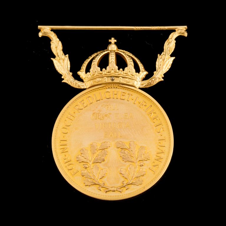 a gold medal 18 k, weight 13 g.