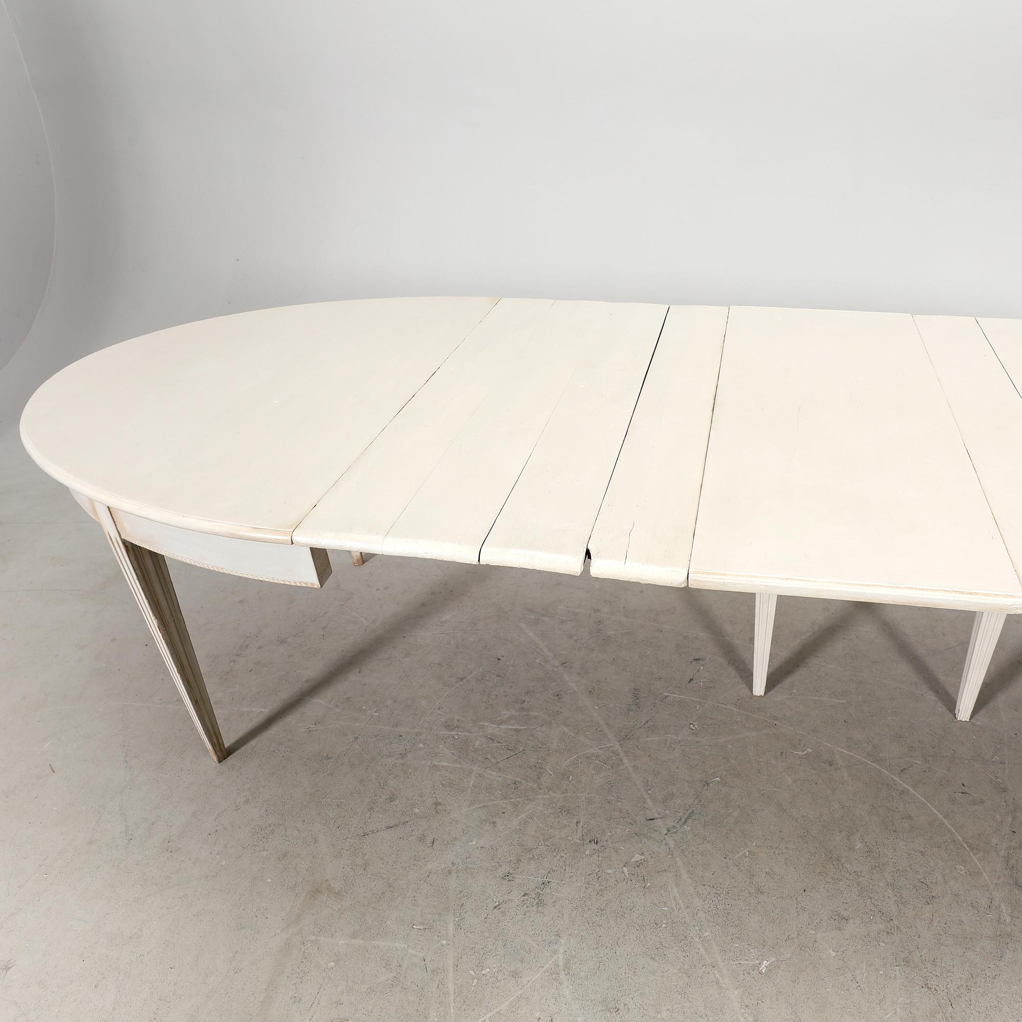 A painted 19th/20th Gustavian style dining table.