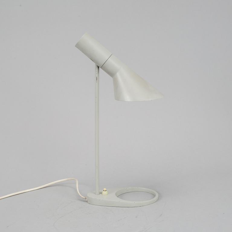 Arne Jacobsen, a grey lacquered 'AJ' table lamp for Louis Poulsen /by license Axel Annell.