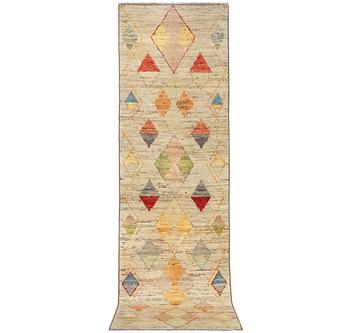A Moroccan runner carpet, c. 392 x 101 cm.