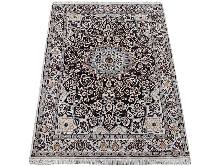 A Nain rug, part silk, 9 laa, c. 210 x 119 cm.