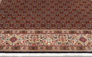 A Moud part silk carpet, signed, 335 x 250 cm.