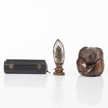 A portable buddhist altar and a figure of 'Weeping Buddha', Japan and Indonesia.