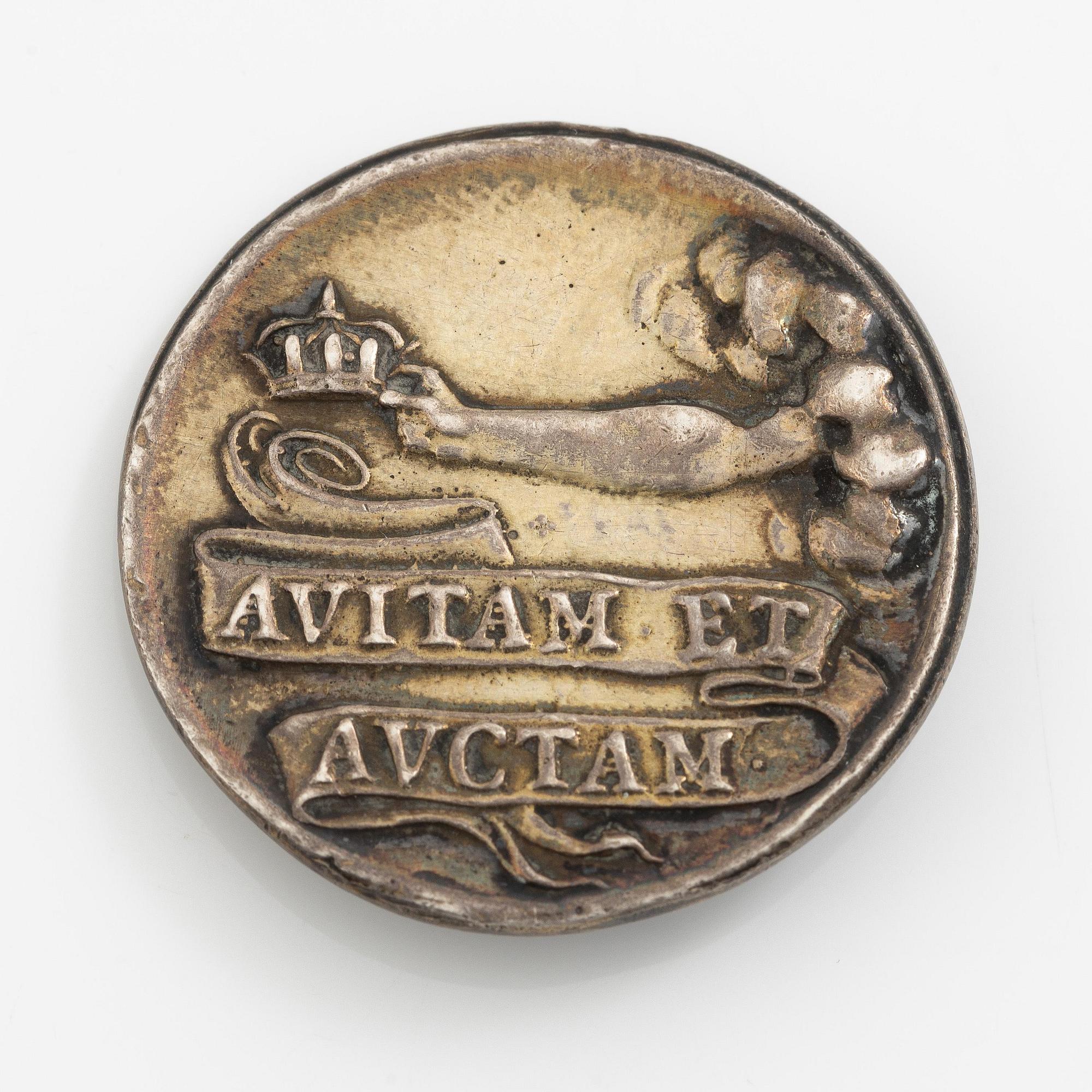 A coin commemorating Christina of Sweden's coronation 1650, by Erich Parise (medal engraver, fl. mid 17th century).