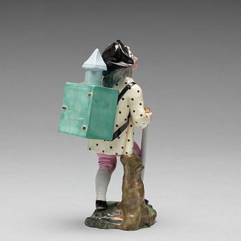 A porcelain figure of a man with a walking staff, 'Höchst mark', 19th Century.