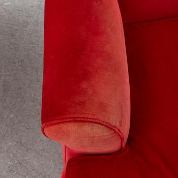 A pair of Howard-style armchairs and a footstool, late 20th century.