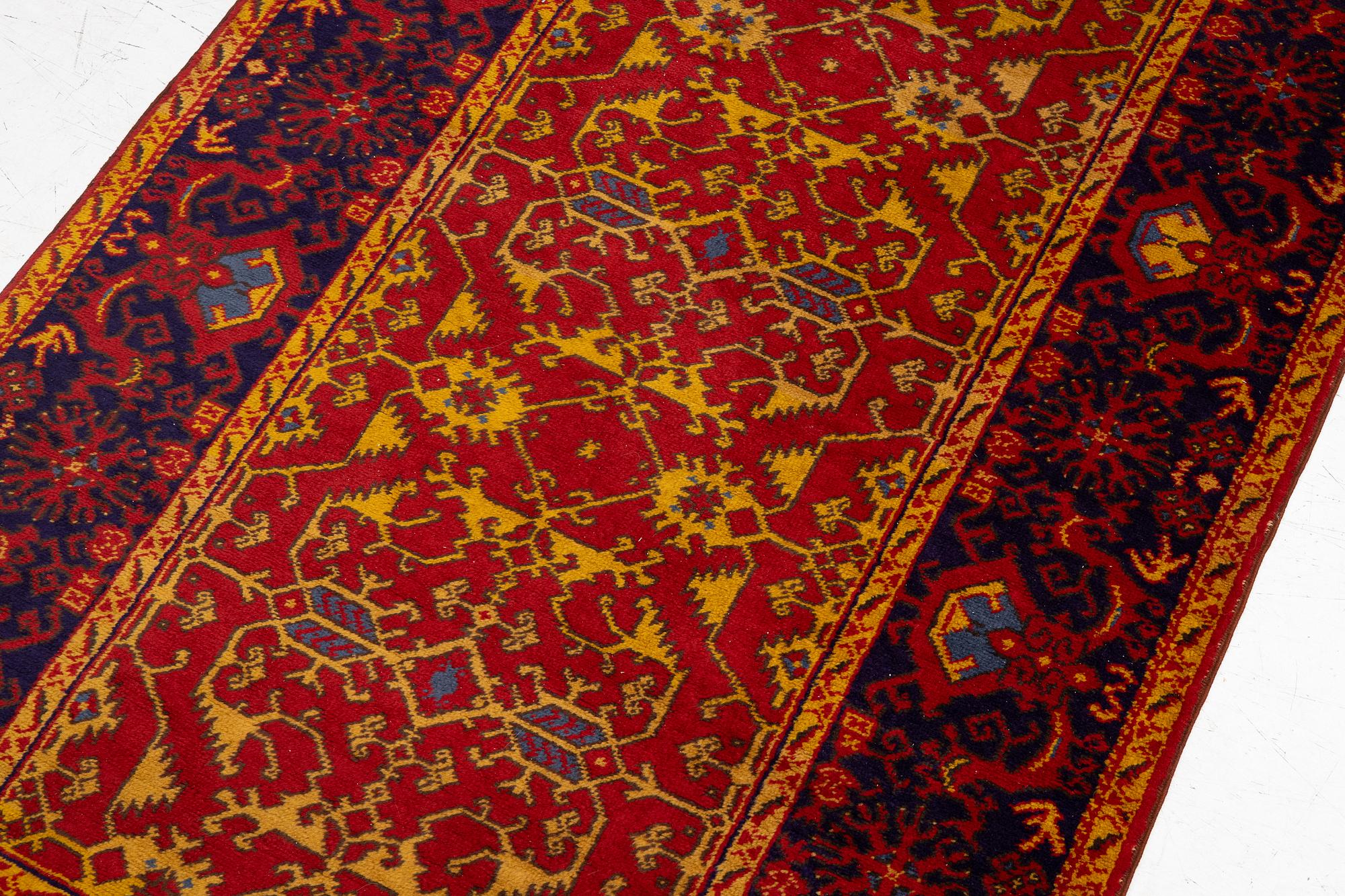 A semi antique Romanian "Lotto" rug, c. 214 x 123 cm.