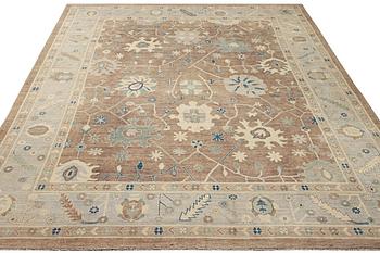 An Ushak design carpet, a. 423 x 305 cm.