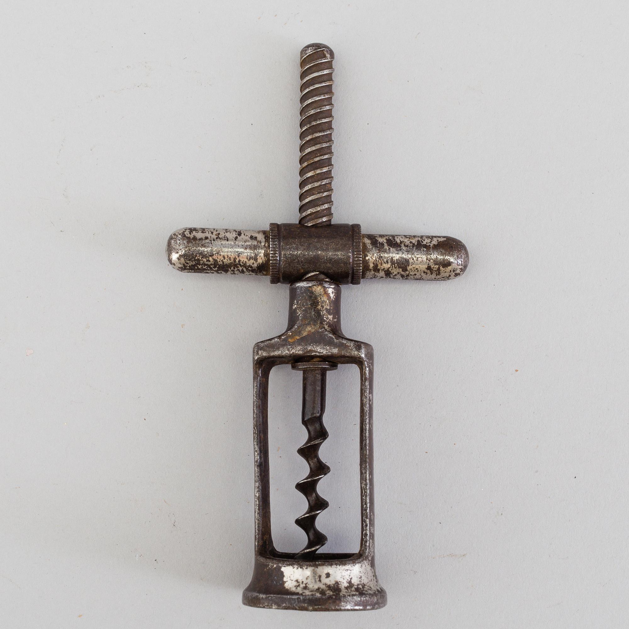 FOUR CAST IRON CORK SCREWS, 19th century.