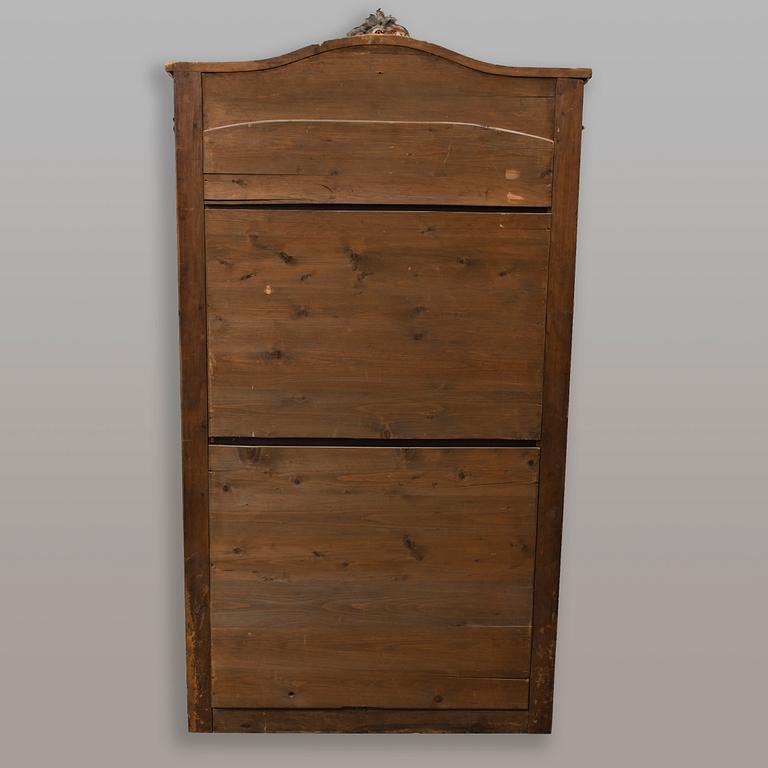 A full-length mirror from the late 19th century.