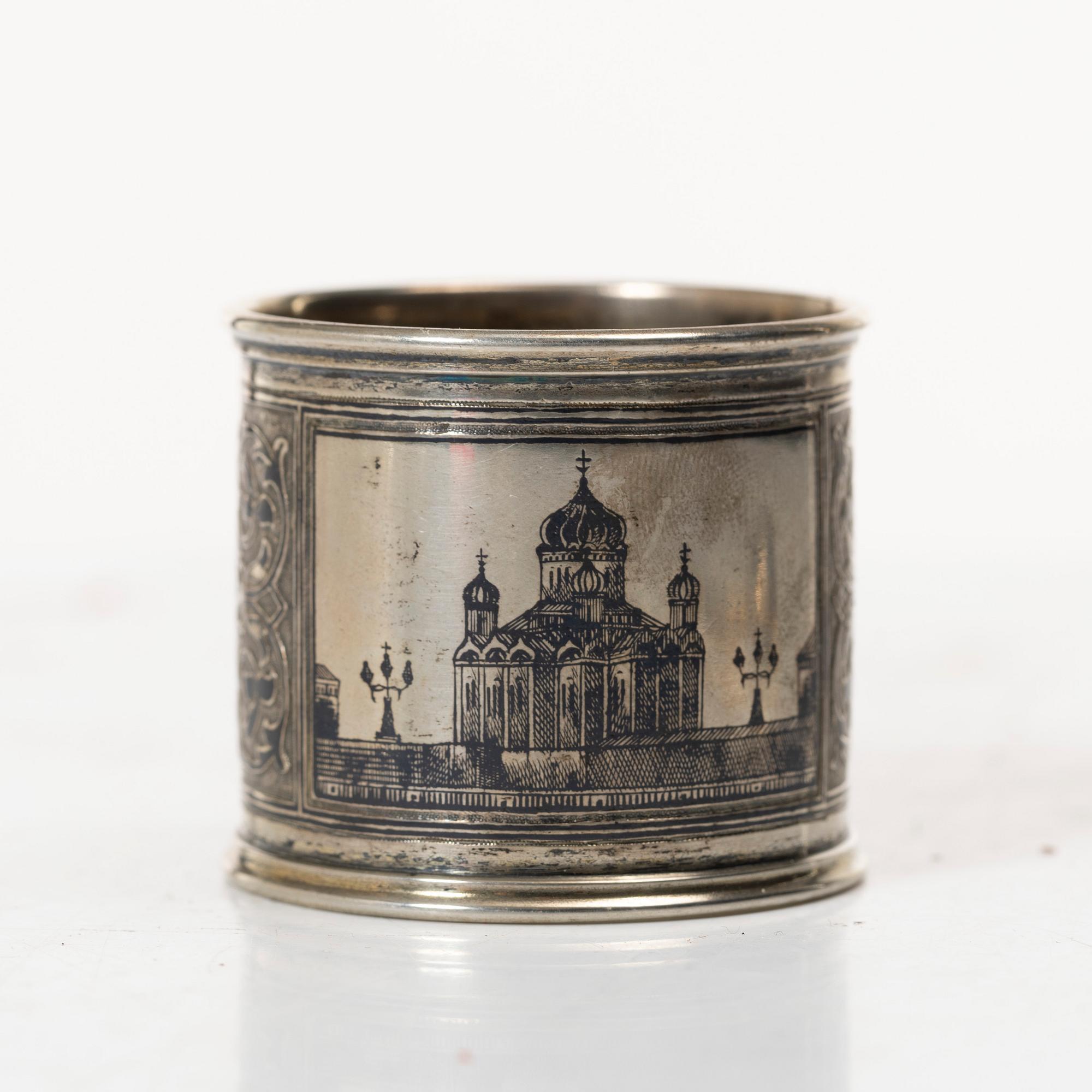 A Russian silver niello napkin ring and spoon, late 19th century-early 20th century.