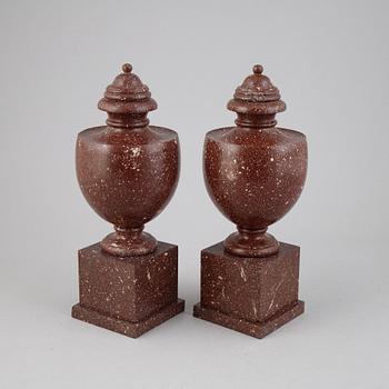 A pair of porphyry urns, presumably first half 20th century.