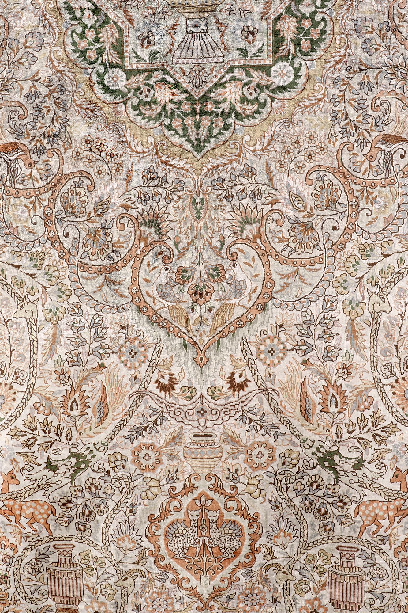 An oval pictoral silk carpet, ca 273 x 180 cm.