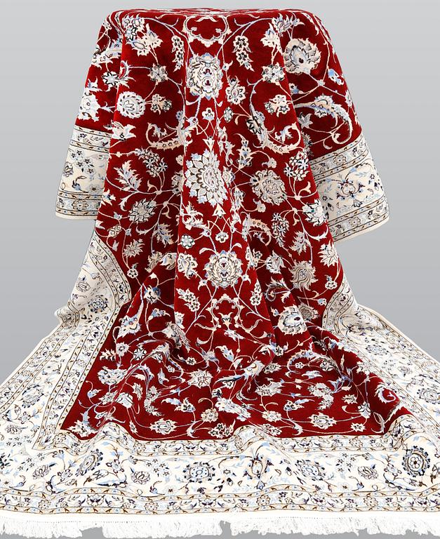 A Nain part silk carpet, 302 x 204 cm.