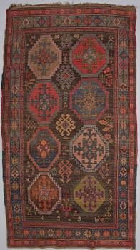 A ANTIQUE KARABAGH CARPET, 247x135 cm.