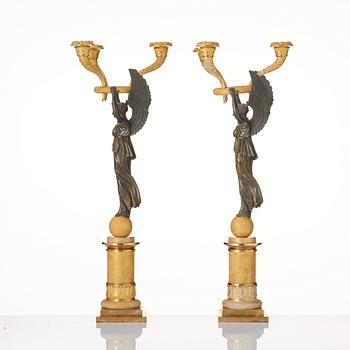 A pair of Empire ormolu and patinated bronze three-branch candelabra, possibly by R. F. Lindroth (1813-17).