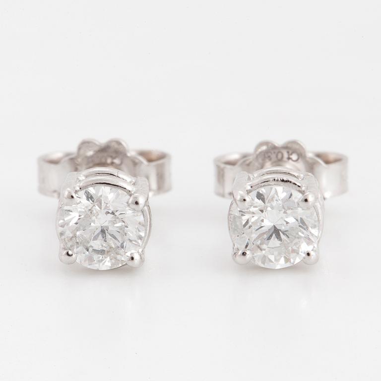 Brilliant-cut diamond stud earrings.