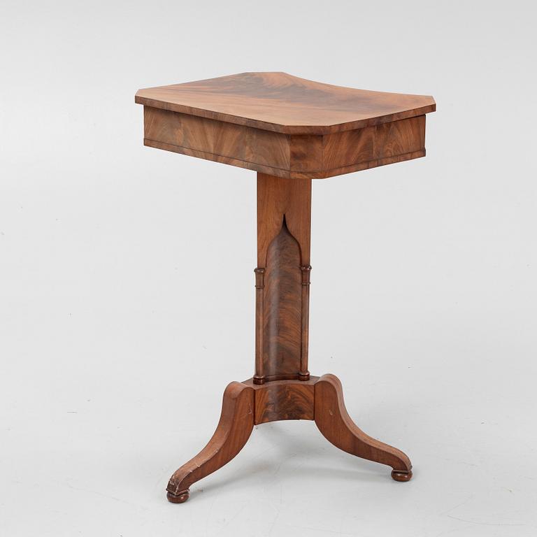 A mid 19th century mahogany work table.