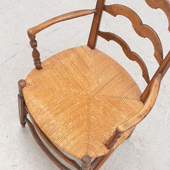 A French walnut open armchair, first part 19th century.