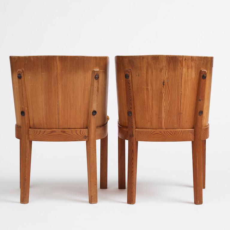Axel Einar Hjorth, a pair of stained pine 'Lovö' chairs, Nordiska Kompaniet, Sweden 1930s.