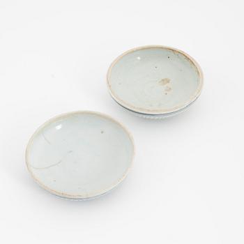 A Chinese blue and white box with cover, Ming dynasty, 17th century and three bowls, Southeast Asia, 19th/20th century.