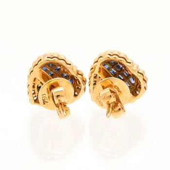 A pair of 18K gold earrings set with round brilliant-cut diamonds and square-cut sapphires.