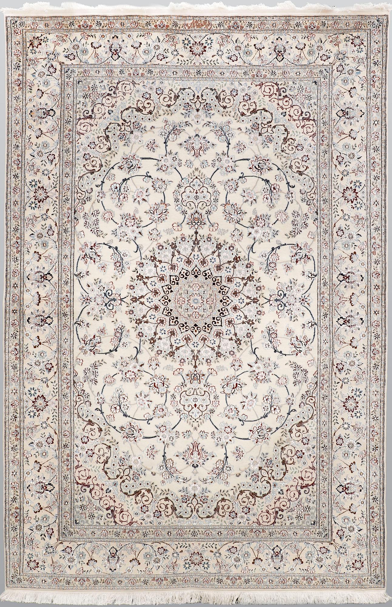 A Nain part silk carpet, 244 x 156 cm.