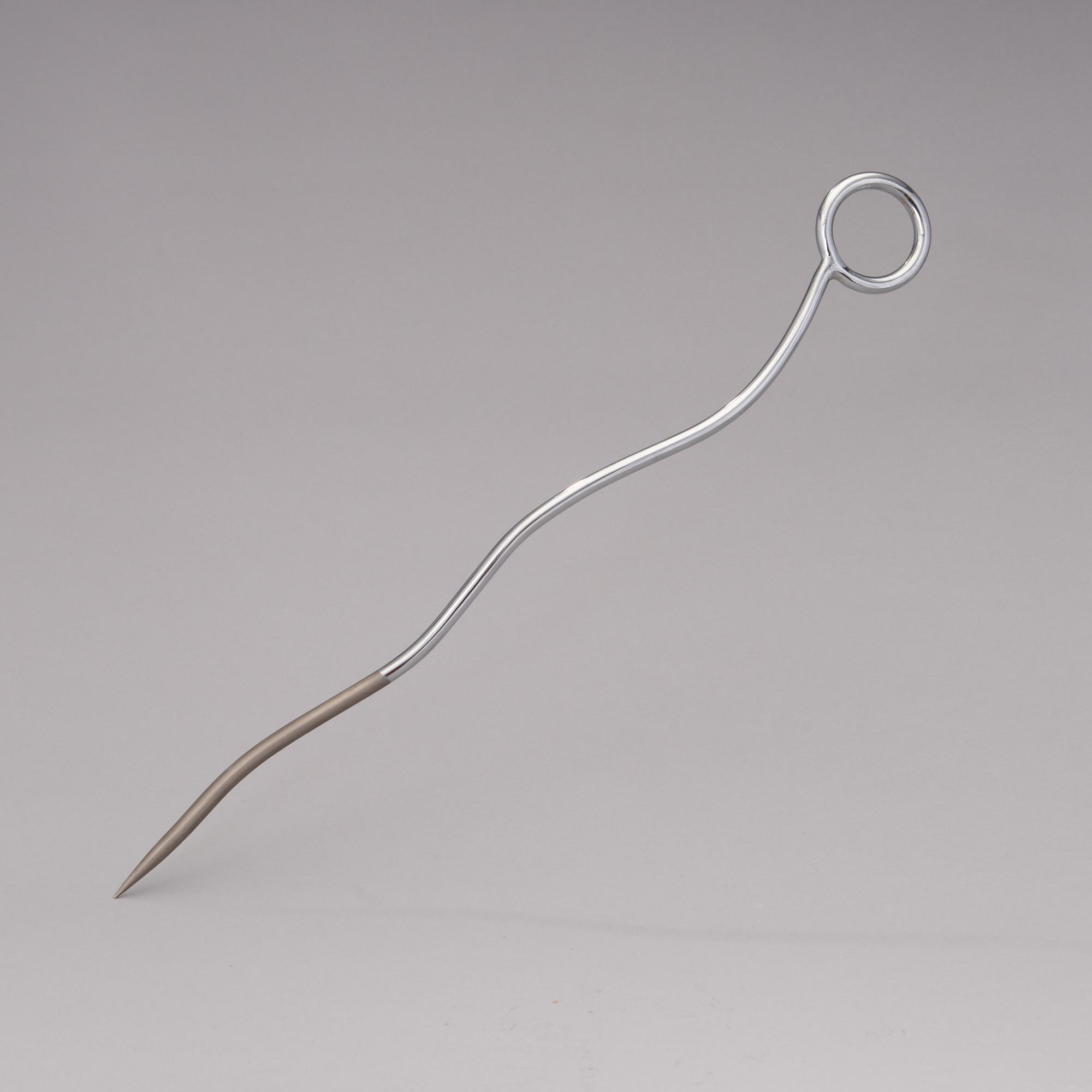 A pair of Chab Wellington coat hooks, a Smoki Christiani cork screw and a Picfeu fireplace poker. Late 1980s.