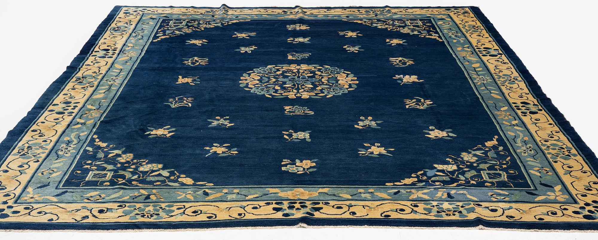 An antique Peking (Beijing) carpet, North China, c. 340 x 275 cm.