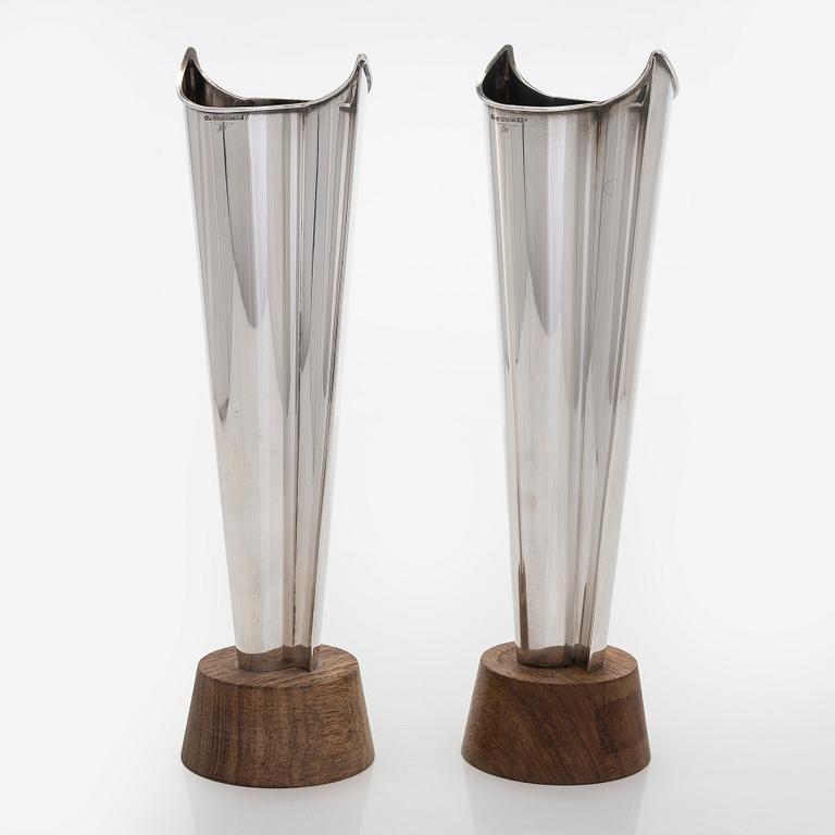 Tapio Wirkkala, two silver and teak 'Flame' vases, Kultakeskus, Hämeenlinna 1962 and 1964.