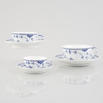 A group of three 'Blue Fluted Half Lace' / 'Musselmalet' tea cups with saucers, Royal Copenhagen, 1893-1900.