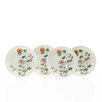 A set of four famille rose floral dishes, Qing dynasty with a apocryphal six character mark.
