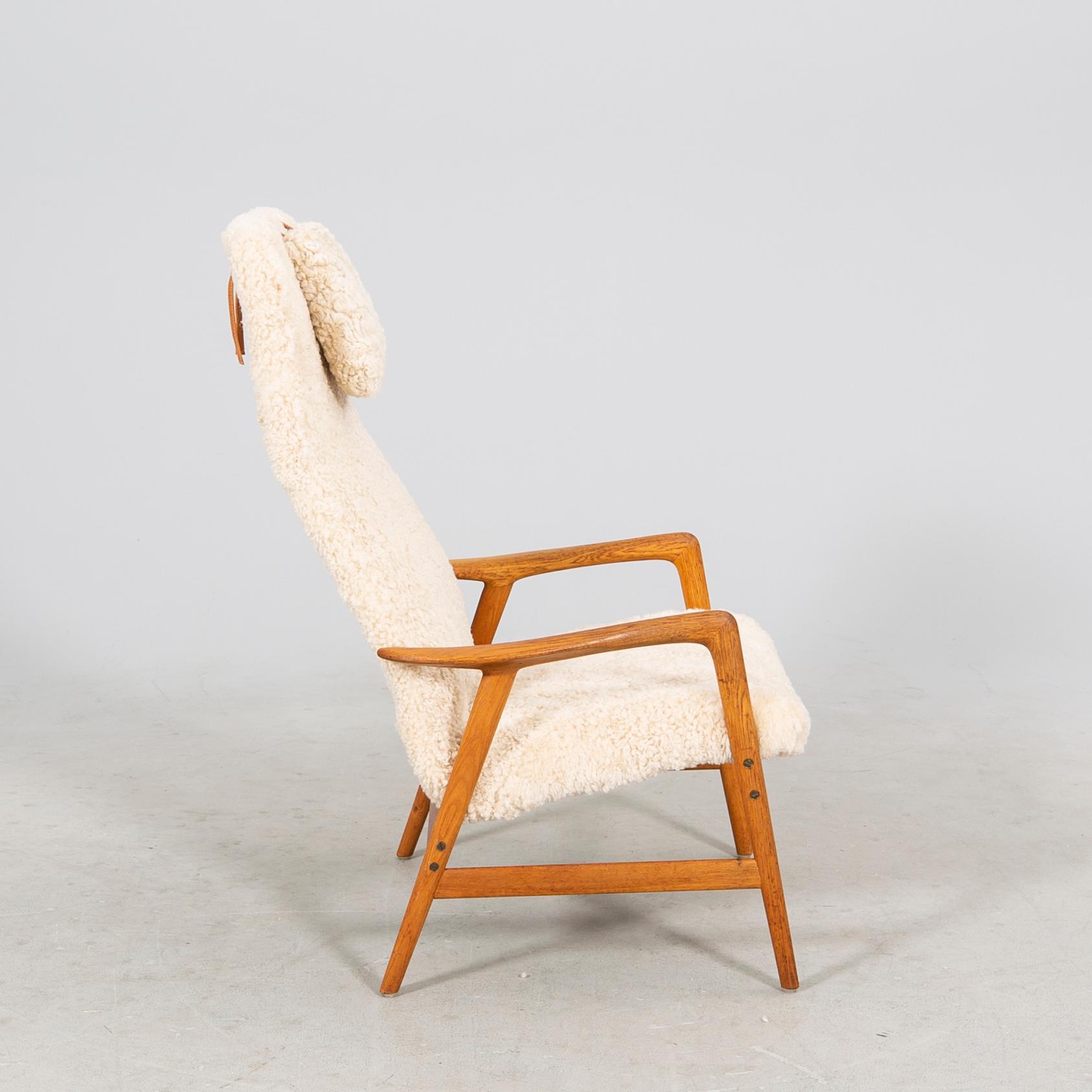 An Alf Svensson Contour-Set 327 sheepskin armchair.