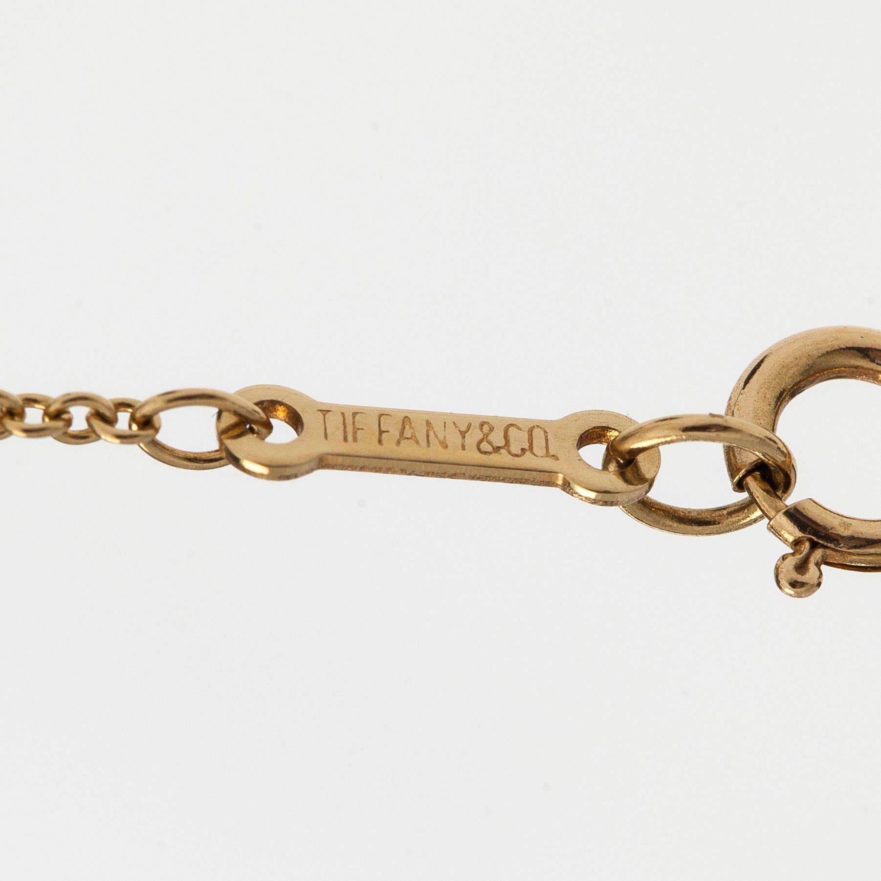 Tiffany & Co, Paloma Picasso, an 18K gold "Loving Heart" necklace.