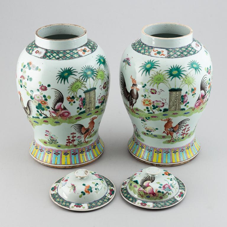 A pair of large Chinese famille rose baluster jars with covers, 20th century.