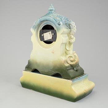 A creamware mantle clock, circa 1900.