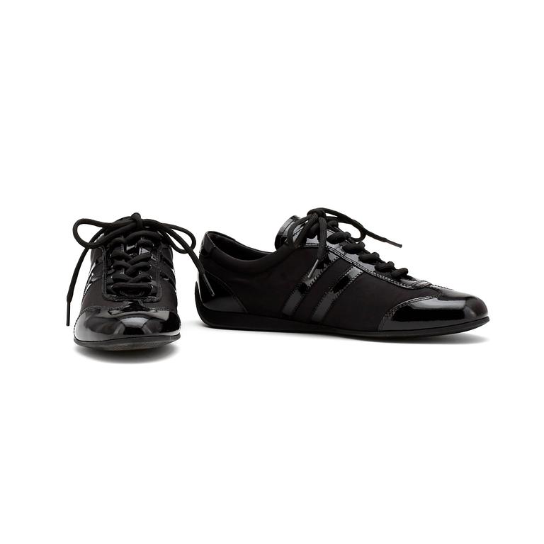 PRADA, a pair of black nylon and leather sneakers.