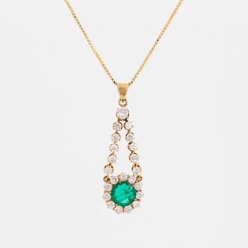 An 18K gold pendant set with a facted emerald.