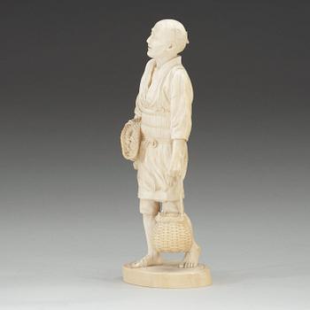 A Japanese ivory figure of a fisherman, Meiji (1868-1912).