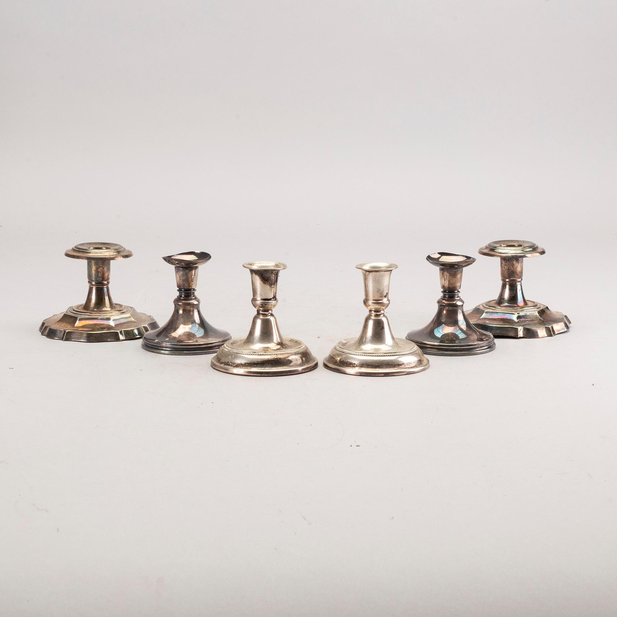 A set of three pair of Swedish 20th century silver candle sticks.