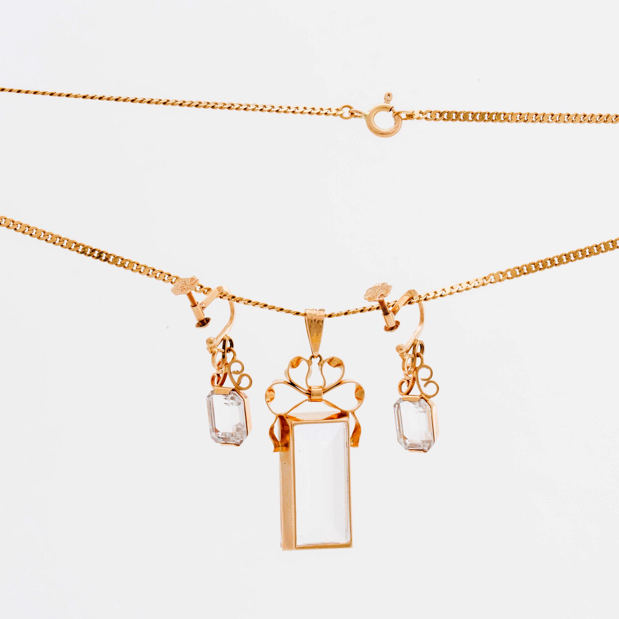 STIGBERT chainn and pendant and earrings, 18l gold and rock crystal.