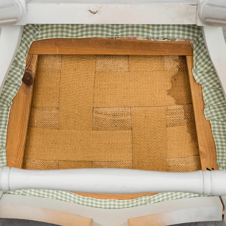 A Gustavian style dining table and ten chairs, 20th century.
