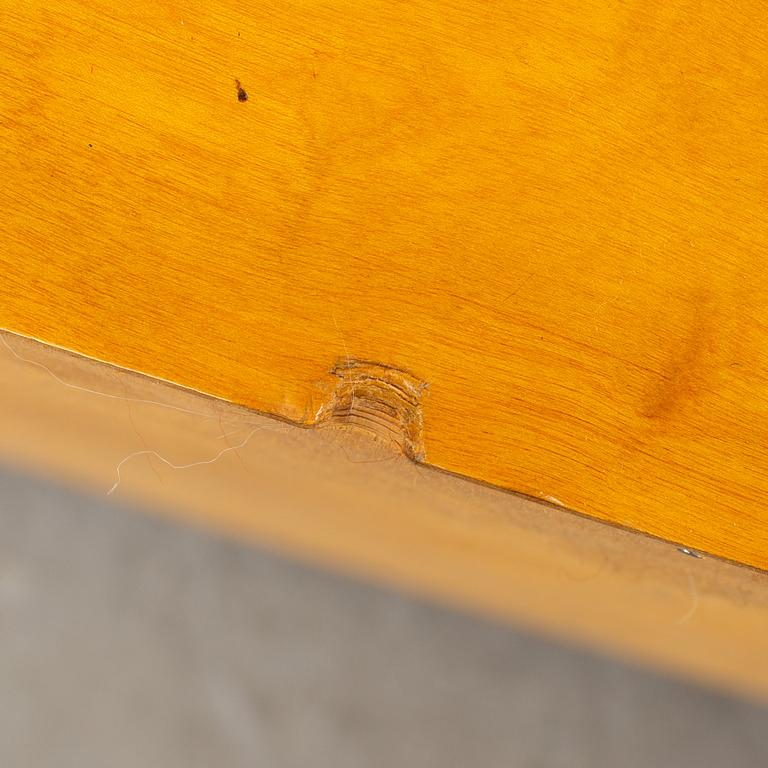 A 1930s birch and elm veneered shelf.