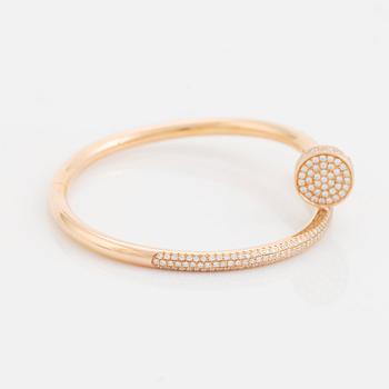 A Cartier "Juste en Clou" bracelet in 18K rose gold set with round brilliant-cut diamonds.