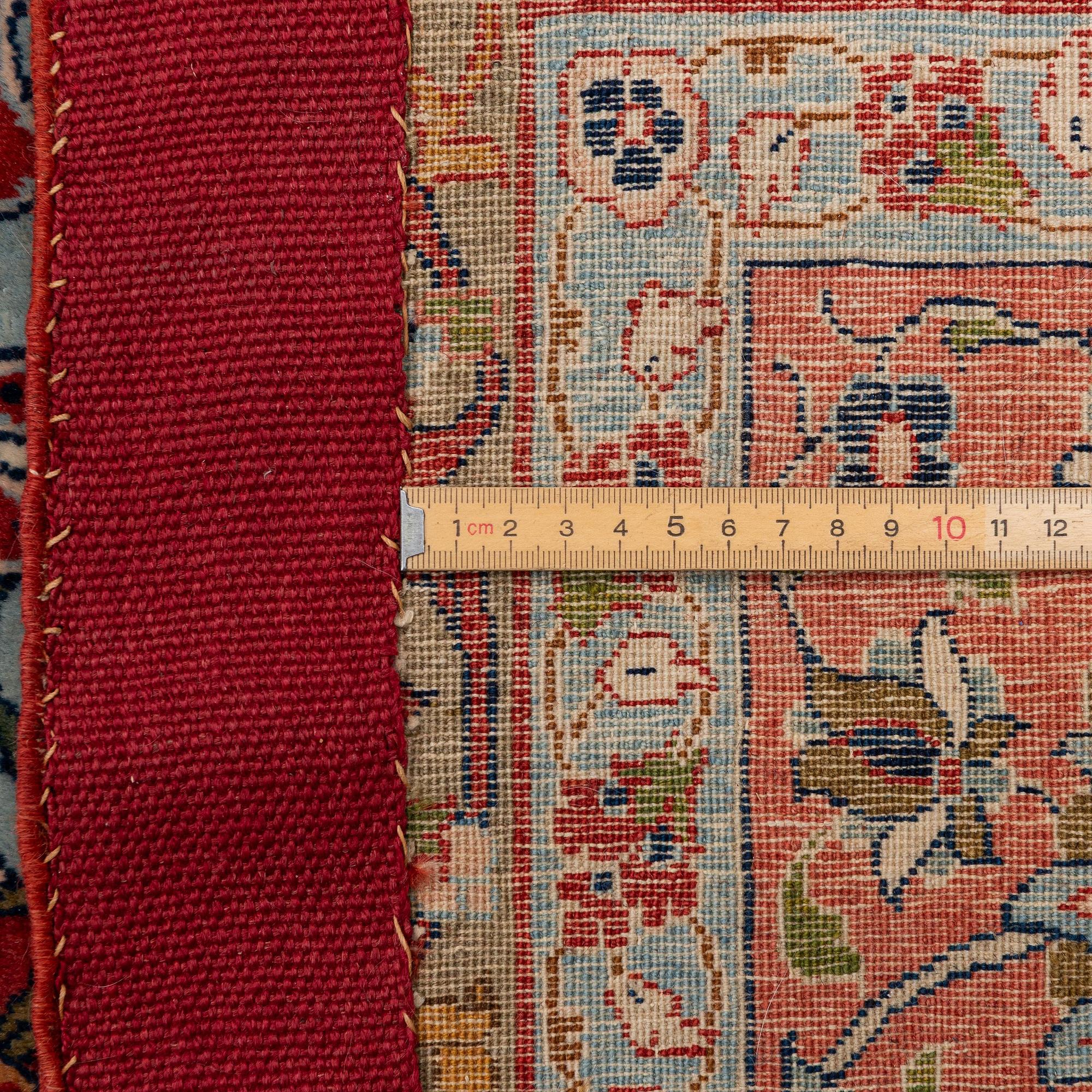 A semi-antique Qum carpet. Central Persia, c. 345 x 258 cm.